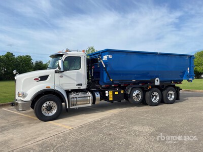 G&H Manufacturing Roll-Off Hoist on a 2024 Peterbilt Model 567 Chassis with Pioneer Rack n Pinion Tarp, Hendrickson COMPOSILITE EXS13K Steerable Roll-Off Lift Axle, Pro-Vision Back Up Camera