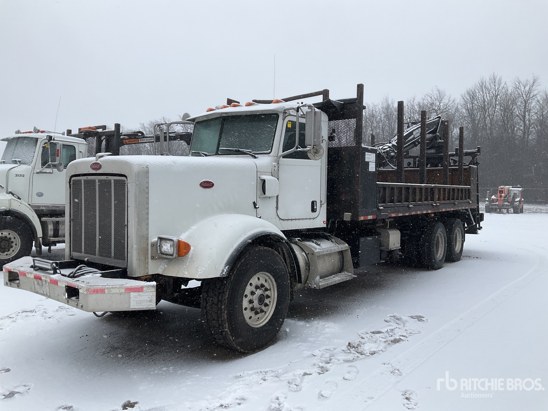 2011 Peterbilt 367 6x4 Self-Loading Log Truck | Ritchie Bros. Auctioneers