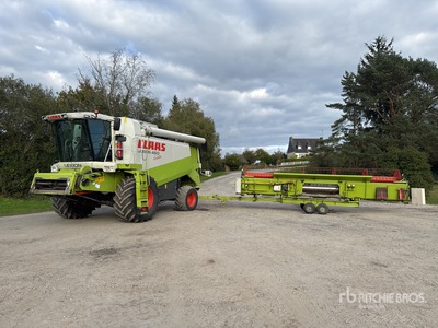 2003 Claas Lexion 460 Evolution Caterpillar C9 engine, with header and header trailer حصادة مجمعة