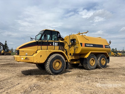 2002 Cat 730 6000 gal 6x6 Camion de agua articulado