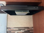 Interior with Stove Hood Exhaust Fan and Vent Cover