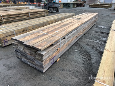 Quantity of (77) Mixed 2 in x 20 ft Surplus Pressure Treated Tablas de madera