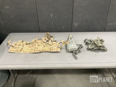 (69) Tactical Assault Panels, (7) Universal Holsters & Assorted Items