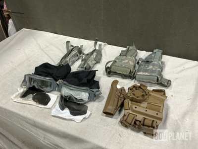 (19) Assorted Holsters, (16) Pairs of Goggles, (1) Marker Light & Assorted Items