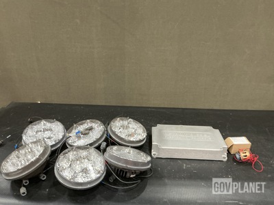 (1) Lens Retainer, (1) Engine Control Module, (16) Headlights & Assorted Items