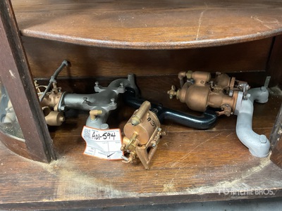 Quantity of (3) Schebler carburetor and manifolds Antichità