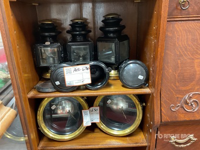 Quantity of Ford antique oil lamps and headlights Antiques