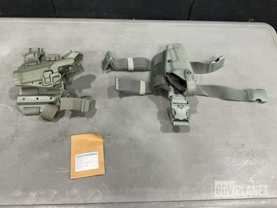 (8) Individual Holsters, (46) Magazine Cap Detents & Assorted Items