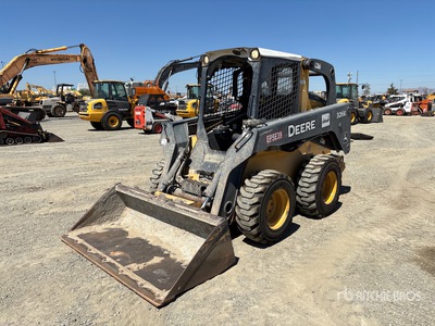 2015 John Deere 326E Minicargadora