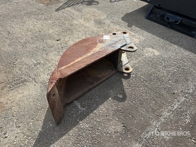 Cat 15 in Excavator Bucket