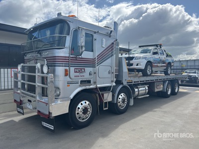 2003 Kenworth K104 8x4 Twin-Steer Sleeper Rollback Truck