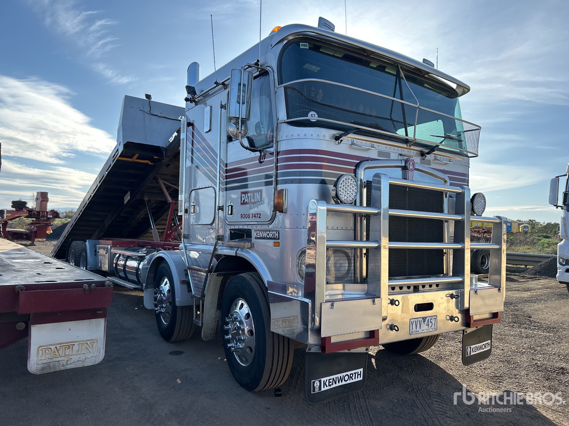2003 Kenworth K104 8x4 Twin-Steer Sleeper Rollback Truck