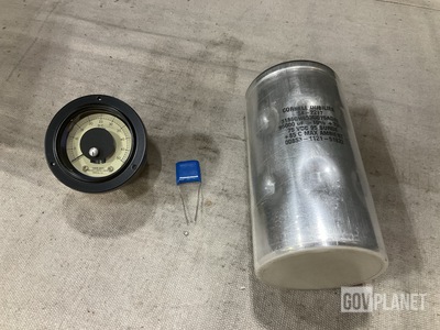 (2) Fixed Capacitors, (4) Voltmeters, (9) Ceramic Capacitors & Assorted Items
