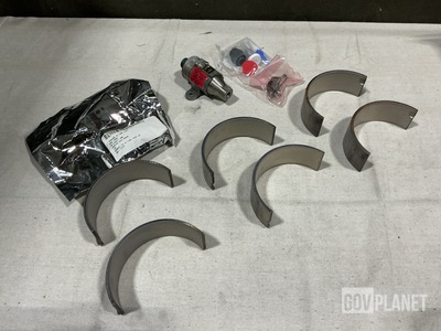(3) Coupling Halves, (1) Transmitter, (12) Bearings & Assorted Items