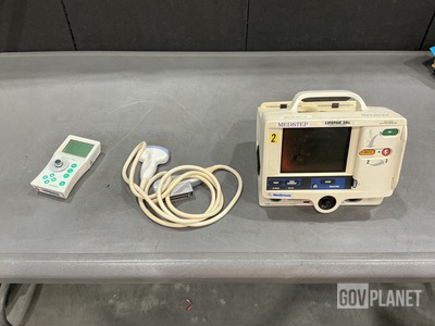 (1) Defibrillator/Monitor, (1) Ultrasound Probe & Assorted Items