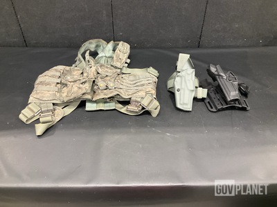 (25) Assorted Holsters, (22) Assault Panels, (1) Vest & Assorted Items