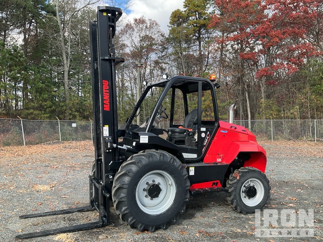 Rough terrain forklift on gravel road