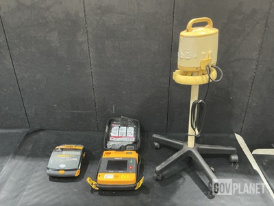 (1) Defibrillator, (1) Breast Pump & Assorted Items