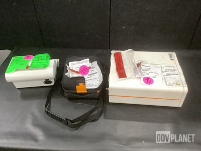 (1) Fluid Management System, (1) Defibrillator & Assorted Items