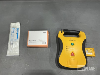 (1) Defibrillator, (1) Package of Nerve Locators & Assorted Items