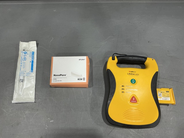 (1) Defibrillator, (1) Package of Nerve Locators & Assorted Items