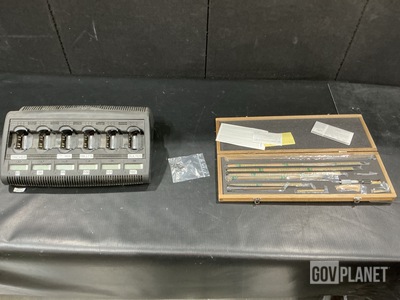 (12) Battery Chargers, (12) Machine Screws, (1) Micrometer & Assorted Items