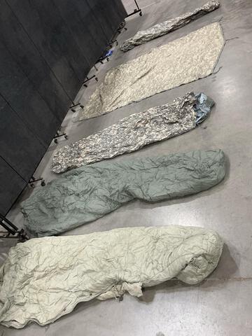 (90) Poncho Liners, (5) Bivy Covers, (2) Sleeping Bags & Assorted Items