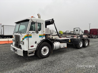 2009 Peterbilt 320 6x4 COE Roll-Off Truck