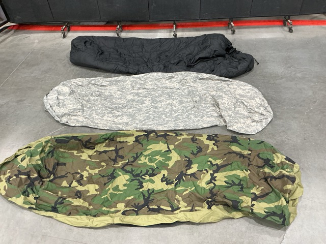 (7) Sleeping Bags, (3) Bivy Covers & Assorted Items