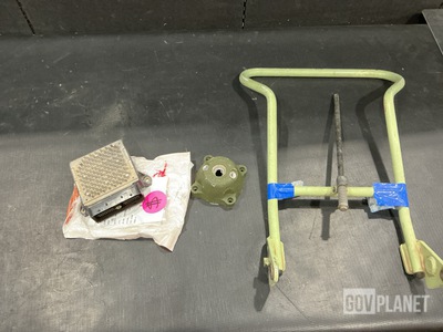 (1) Foot Rest, (1) Transmission Module, (4) Wheel Hub Caps & Assorted Items