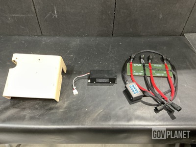 (1) Wiring Harness, (1) Battery Charger, (2) Brackets & Assorted Items