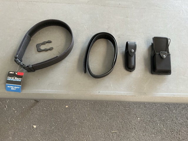 (390) Light Cases, (246) Radio Pouches, (180) Ultra Duty Belts & Assorted Items