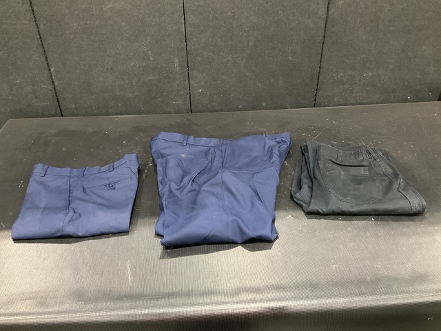 (129) Pairs of Trousers, (58) Pairs of Slacks (4) Duffel Bags & Assorted Items