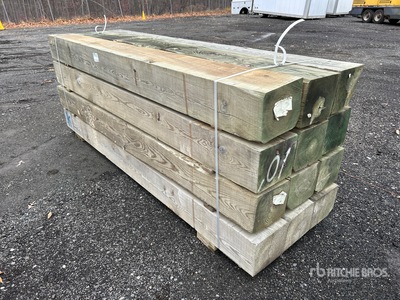 Quantity of (12) 10 in x 12 in x 10 ft Surplus Pressure Treated Lumber