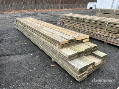 Quantity of (32) 3 in x 10 in x 16 ft - 20 ft Surplus Pressure Treated Lumber