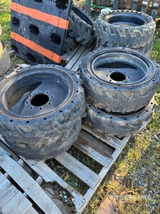Quantity of (32) Skid Steer Tires & Wheels