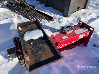 Brise-roche pour chargeuse à différentiel