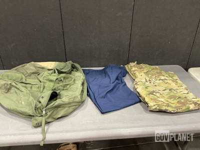 (28) Pairs of Women’s Slacks, (68) Pairs of Wet Weather Trousers & Assorted Item