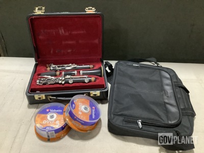 (46) Spindle Disk Packs, (12) Laptop Bags, (1) Clarinet & Assorted Items