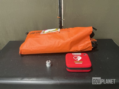 (1) Defibrillator, (1) Litter Splint & Assorted Items