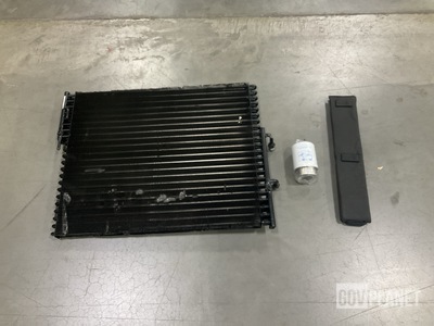 (1) Oil Cooler, (32) Fluid Filters, (13) Belts & Assorted Items