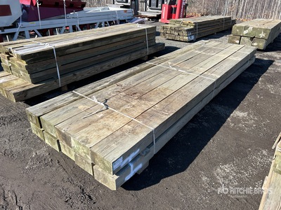 Quantity of (10) Surplus Pressure Treated 6 in x 10 in x 14 ft 木材