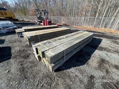 Quantity of (6) Surplus Pressure Treated 10 in x 12in x 12 ft 木材