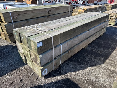Quantity of (9) Surplus Pressure Treated 10 in x 12 in x 12 ft 木材