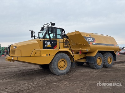 2015 Cat 730C 6000 gal 6x6 Camion-citerne à eau articulé