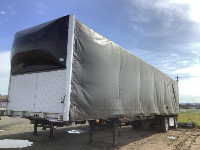 1997 East 46 ft T/A Spread Axle Curtain Side Trailer