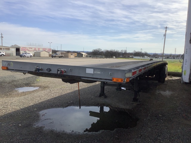 1999 East 46 ft T/A Spread Axle Flatbed Trailer