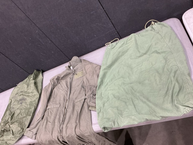 (2) Pairs of Flyer&rsquo;s Coveralls, (35) Clothing Bags & Assorted Items