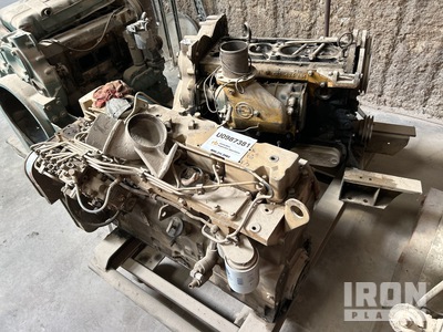 Cummins and Detroit engines and one box of parts for both engines. Motor (Inoperable)