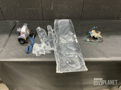 (1) Digital Still Camera, (4) TV Stands & Assorted Items